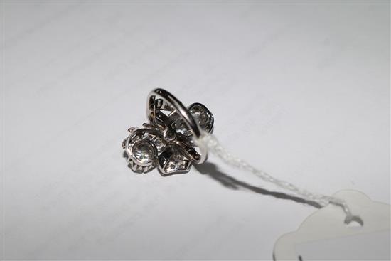 An 18ct white gold and diamond cluster upfinger ring, size M.